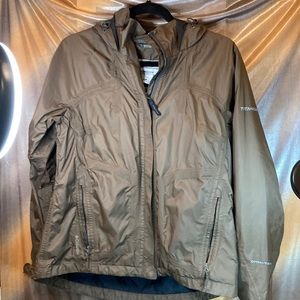 Columbia chocolate wind breaker. Titanium omni-tech. Small tear‎ by zipper. 350
